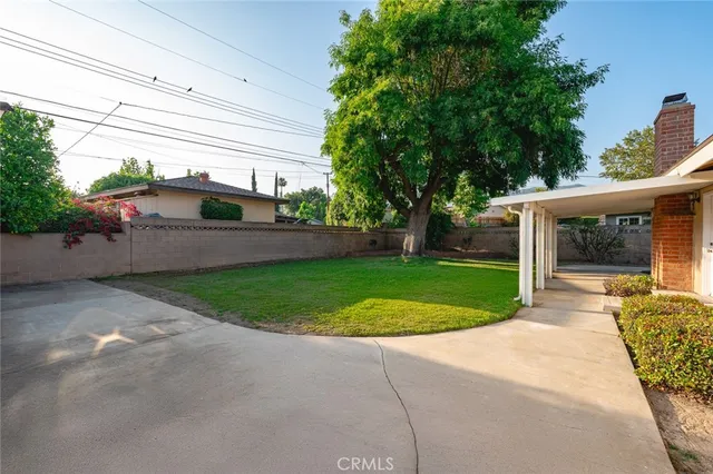 a view of a backyard with a patio