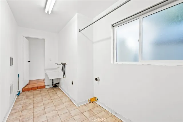 a large white bed in a white room