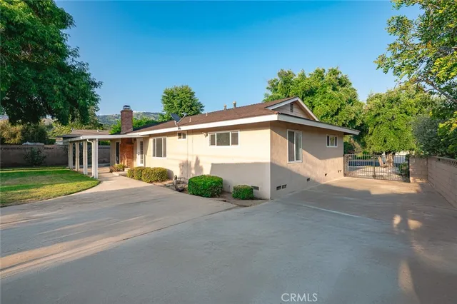 a view of a house with a street