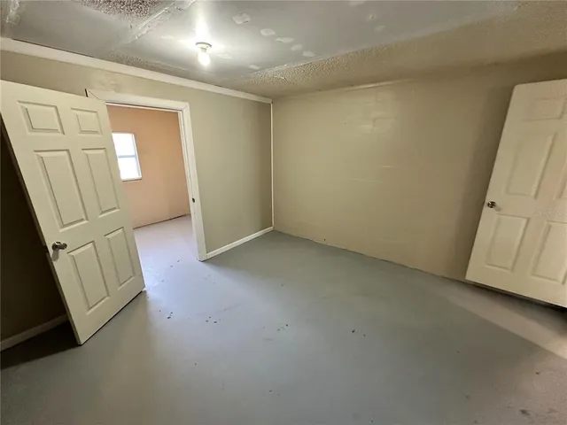 an empty room with a fireplace