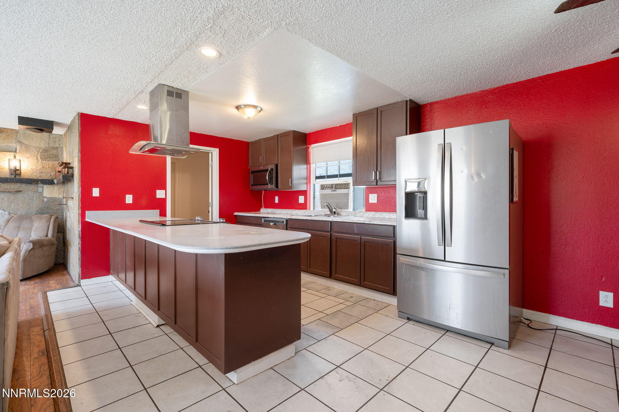 3590 Siskin Lane Reno, NV 89508 - Photo 4 of 31 a kitchen with stainless steel appliances a refrigerator sink and cabinets