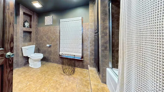 a bathroom with a sink vanity granite and a mirror