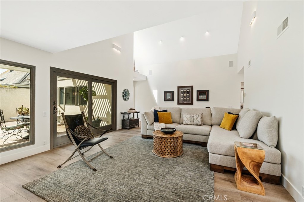 23862 Marmara Bay Dana Point, CA 92629 - Photo 5 of 21 a living room with furniture and a floor to ceiling window