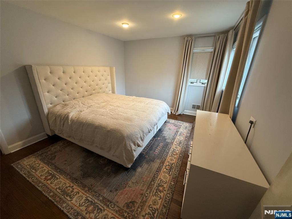 9 Gibbs Road Dumont, NJ 07628 - Photo 16 of 21 a bed sitting in a bedroom next to a window