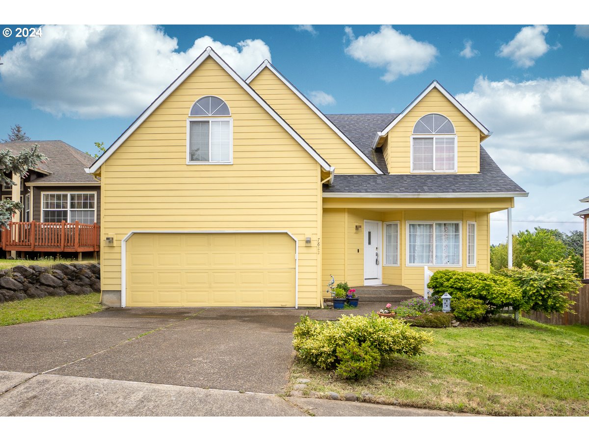 7822 Southwest 171st Place Beaverton, OR 97007 - Photo 1 of 20 a front view of a house with a garden and entryway