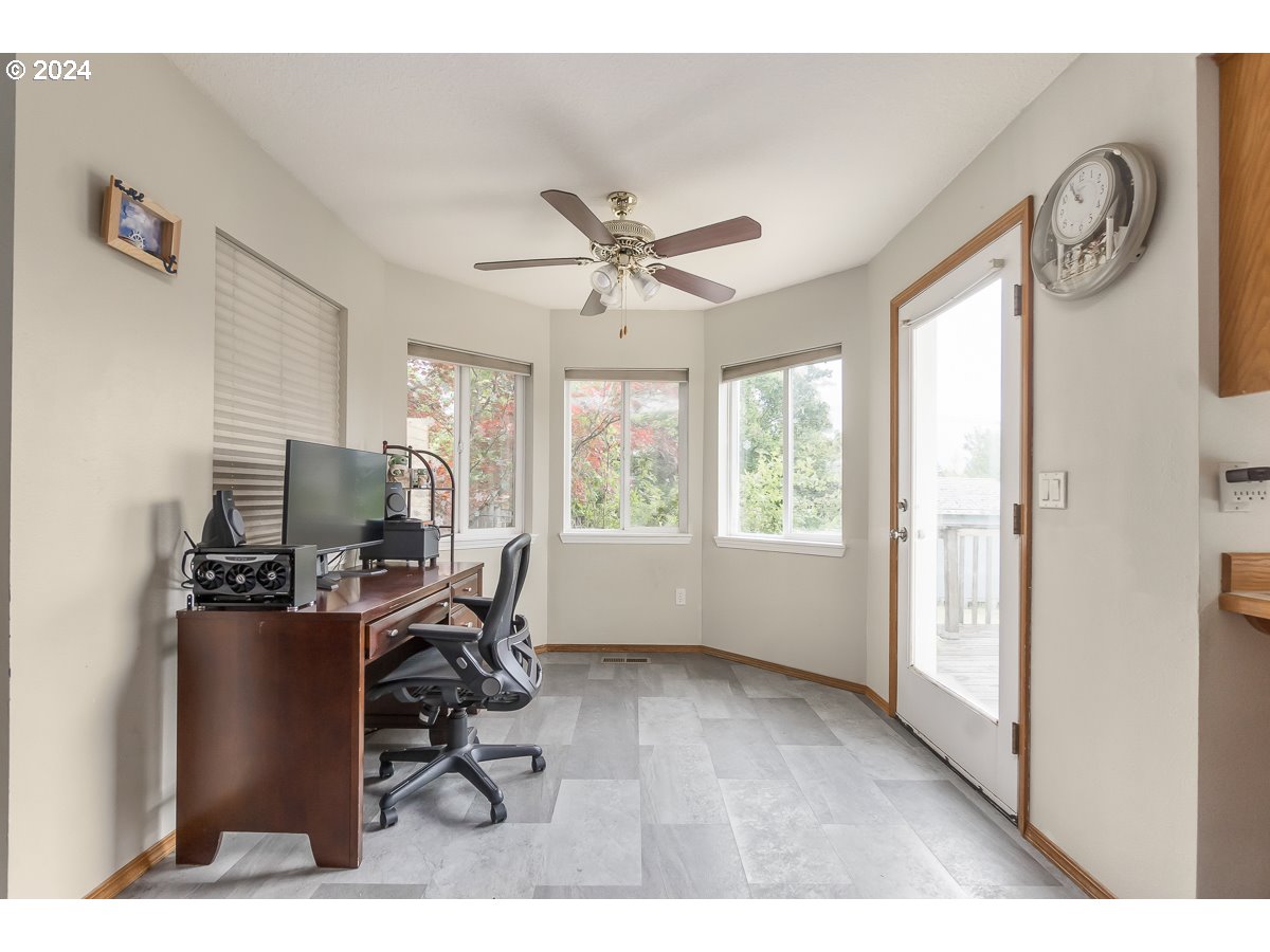 7822 Southwest 171st Place Beaverton, OR 97007 - Photo 11 of 20 a workspace with furniture and a window