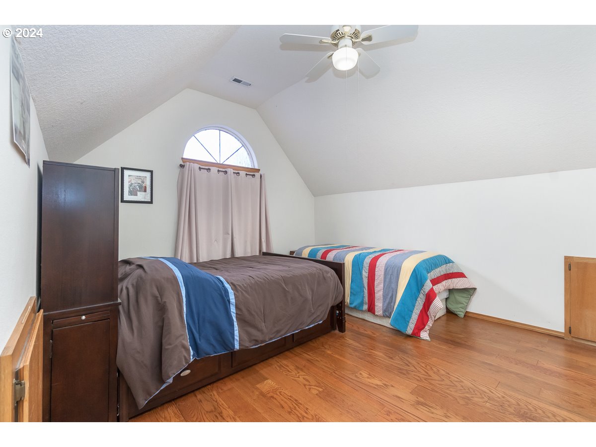 7822 Southwest 171st Place Beaverton, OR 97007 - Photo 14 of 20 a view of bedroom with wooden floor