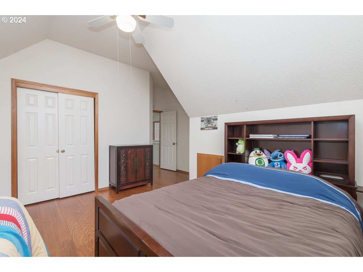 7822 Southwest 171st Place Beaverton, OR 97007 - Photo 15 of 20 a bedroom with a bed and a dresser