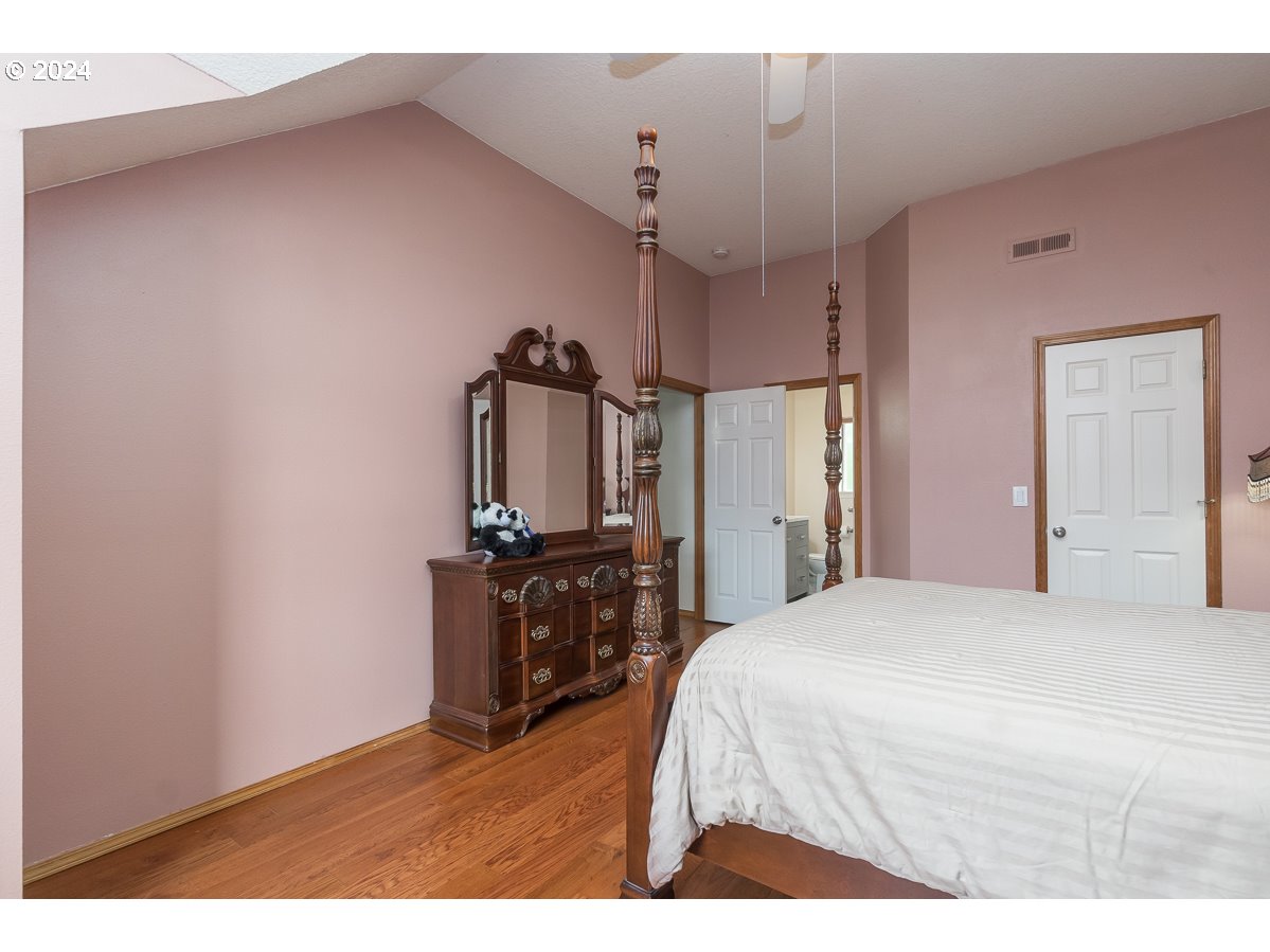7822 Southwest 171st Place Beaverton, OR 97007 - Photo 18 of 20 a bedroom with a bed and a television