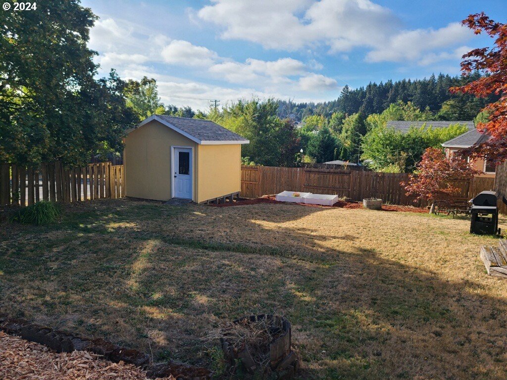 7822 Southwest 171st Place Beaverton, OR 97007 - Photo 20 of 20 a view of a house with a yard