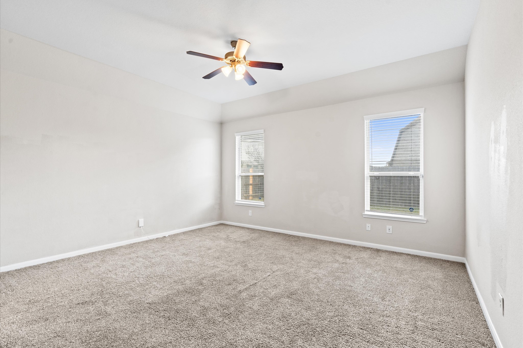 410 Richfish Run Drive Rosenberg, TX 77469 - Photo 13 of 30 Spacious Master Suite with Ample Natural Light from Dual Windows