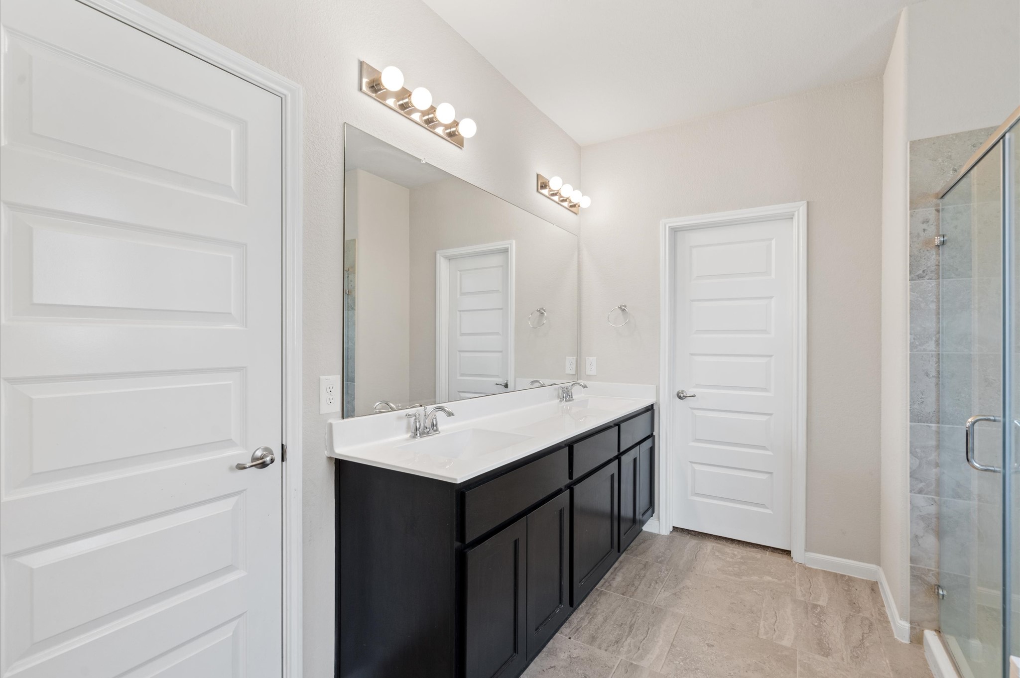 410 Richfish Run Drive Rosenberg, TX 77469 - Photo 15 of 30 Elegant ensuite with dual-sink vanity and modern finishes.