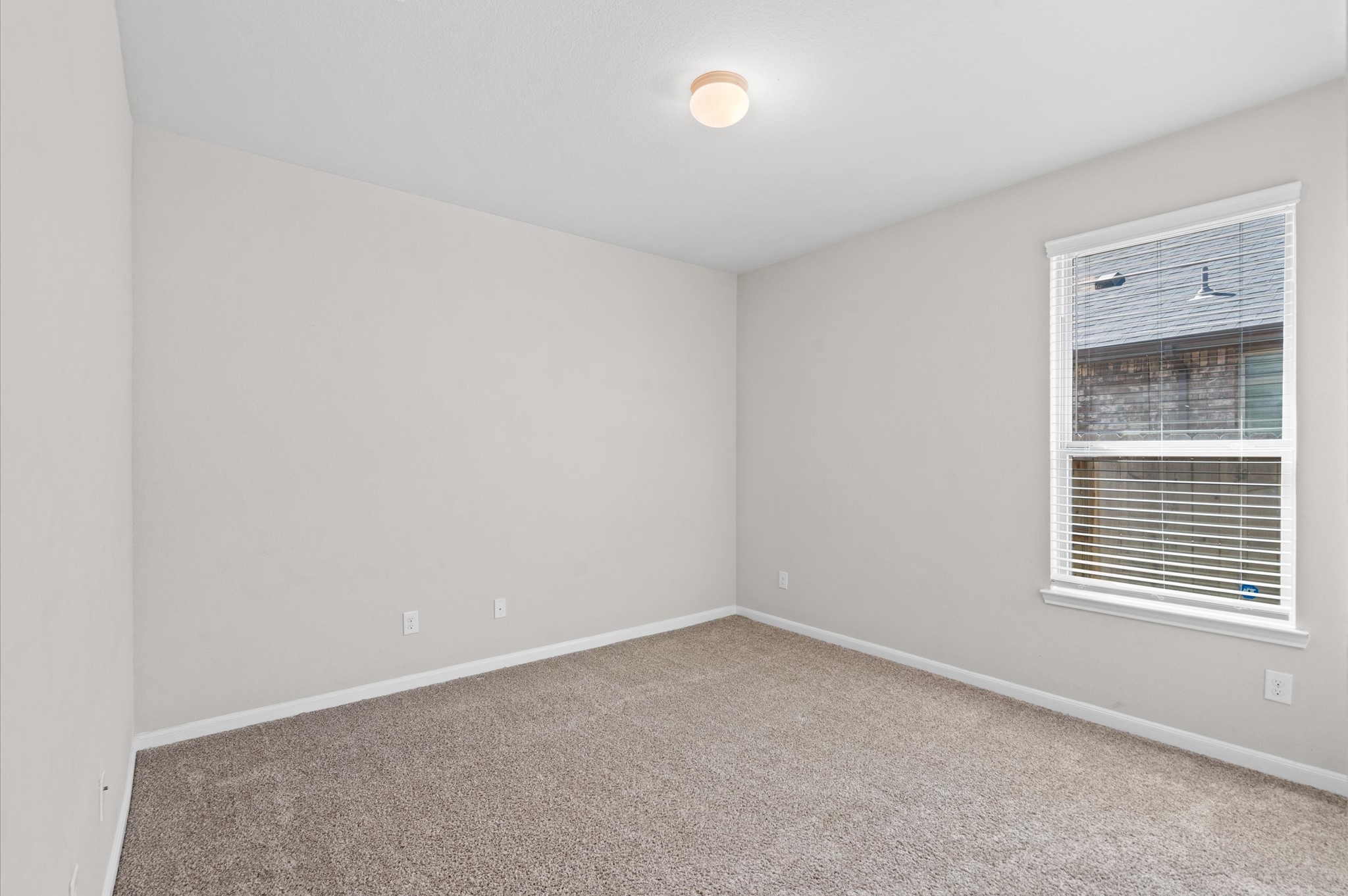 410 Richfish Run Drive Rosenberg, TX 77469 - Photo 20 of 30 Cozy Guest Bedroom with Plush Carpet and Ample Natural Light