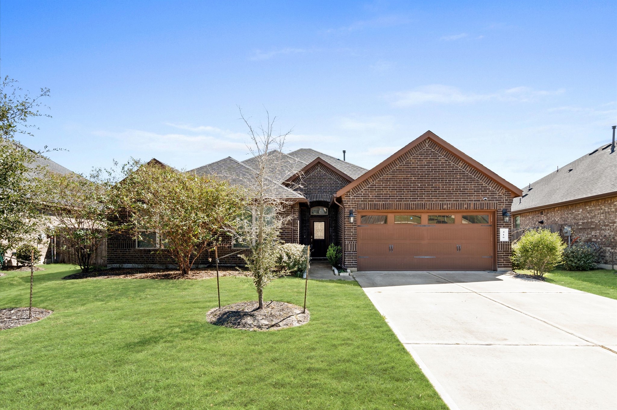 410 Richfish Run Drive Rosenberg, TX 77469 - Photo 26 of 30 Welcome to this charming residence, showcasing a well-manicured lawn and inviting facade with ample garage space—your perfect suburban retreat.