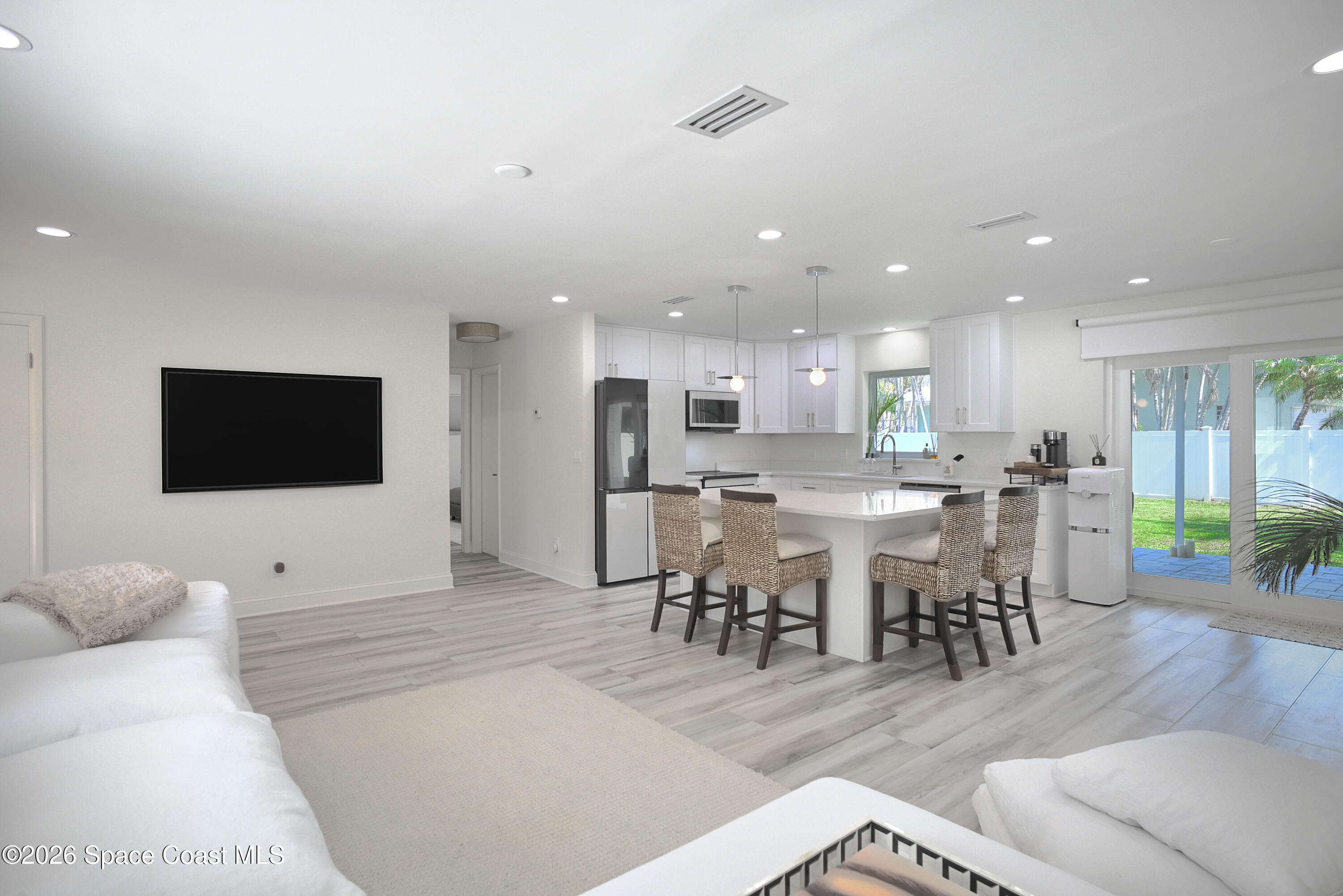 1162 Samar Road Cocoa Beach, FL 32931 - Photo 4 of 27 Living Room Toward Kitchen