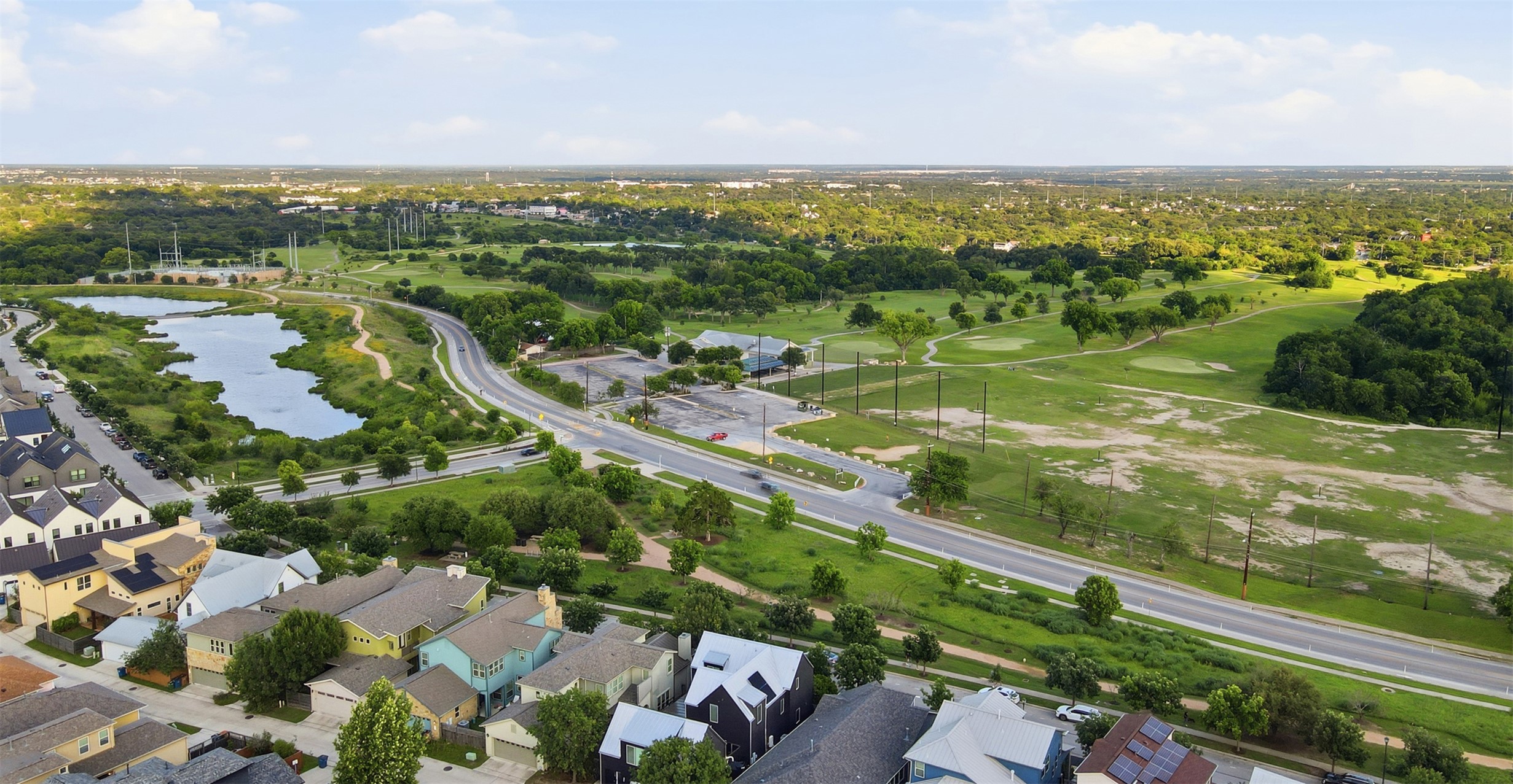 3901 Vaughan Street Austin, TX 78723 - Photo 35 of 37 Aerial perspective showcasing residential properties bordering a golf course and a natural water feature