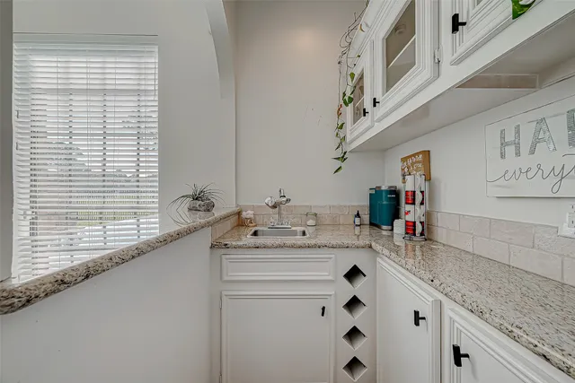 a bathroom with a toilet and a shower curtain
