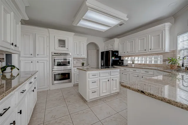 a bathroom with a bathtub and a sink