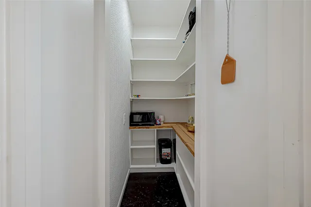 a view of a park with a big yard and large trees