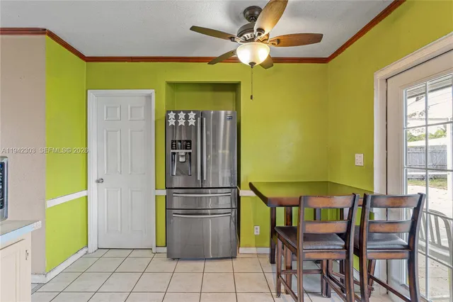 a view of a dining area with furniture and a window