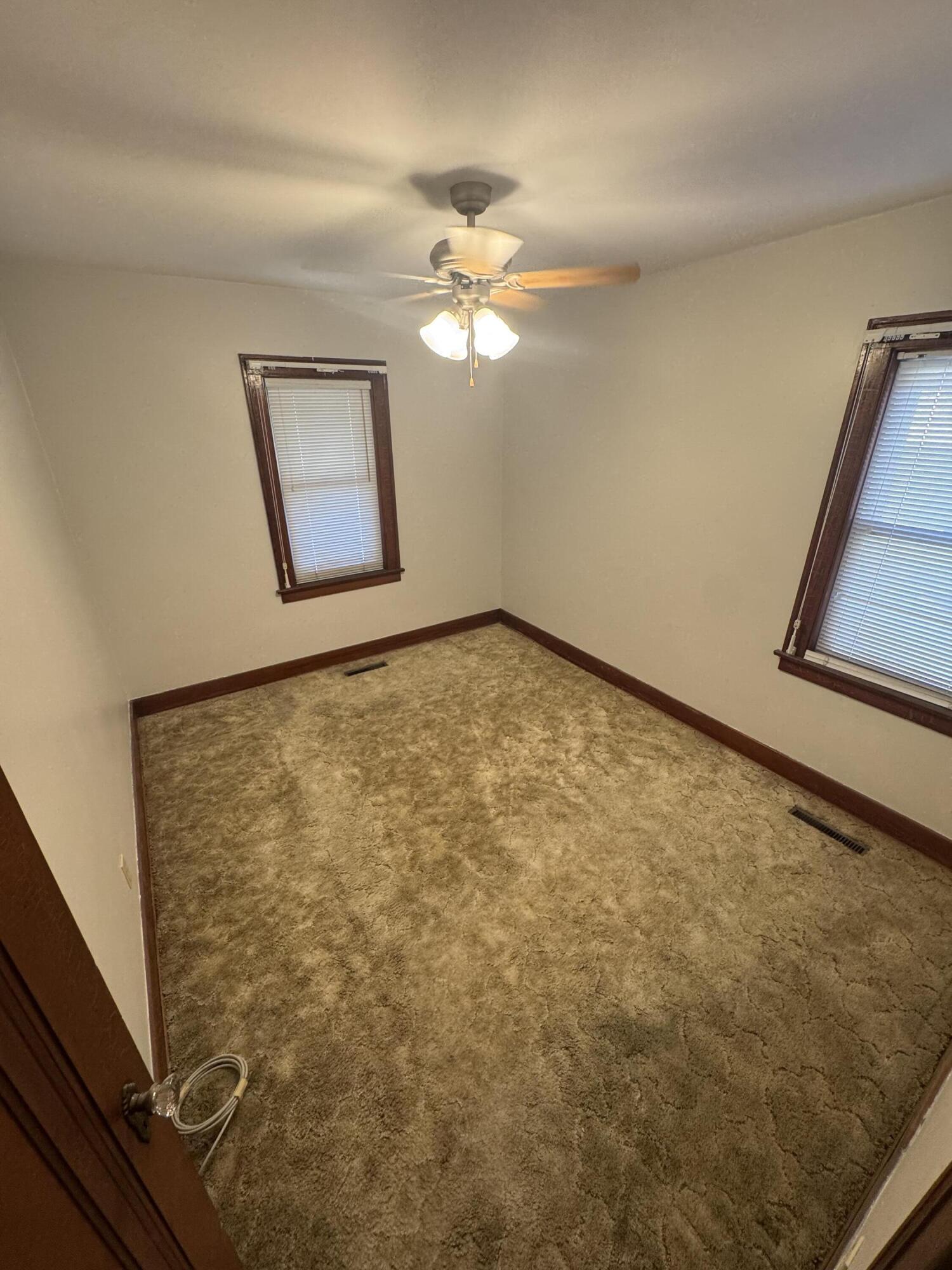 2144 Superior Avenue Whiting, IN 46394 - Photo 7 of 12 a view of a room with a window and a ceiling fan