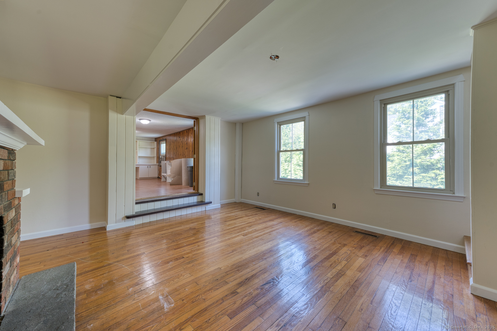 134 East Street Litchfield, CT 06759 - Photo 13 of 38 a view of an empty room with wooden floor and a window