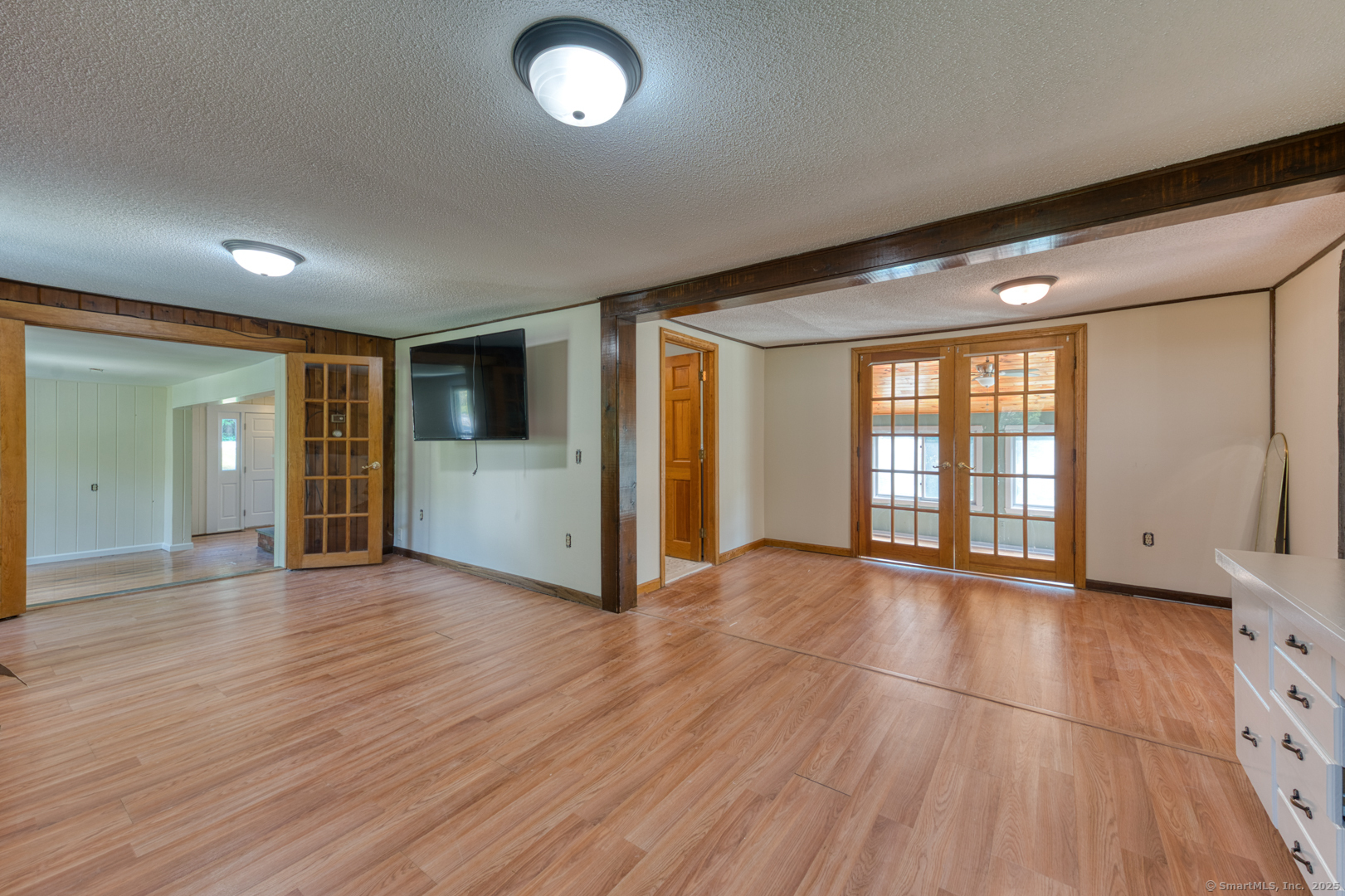 134 East Street Litchfield, CT 06759 - Photo 16 of 38 an empty room with wooden floor and windows