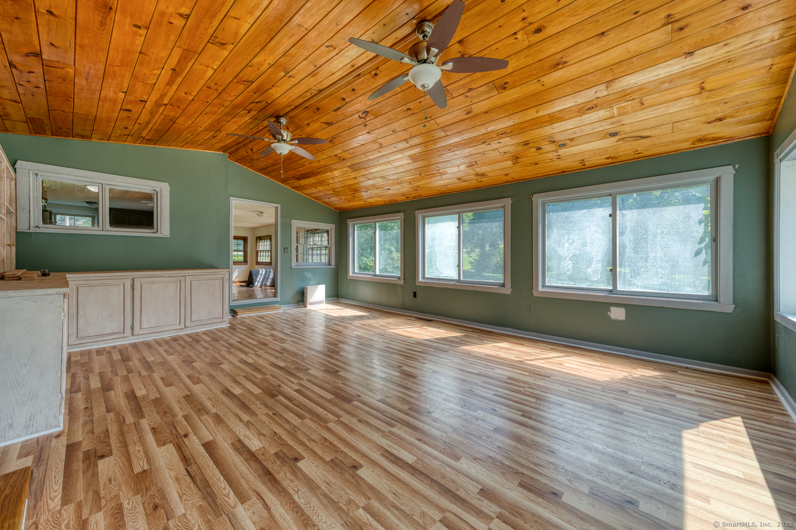134 East Street Litchfield, CT 06759 - Photo 23 of 38 a view of empty room with wooden floor and fan