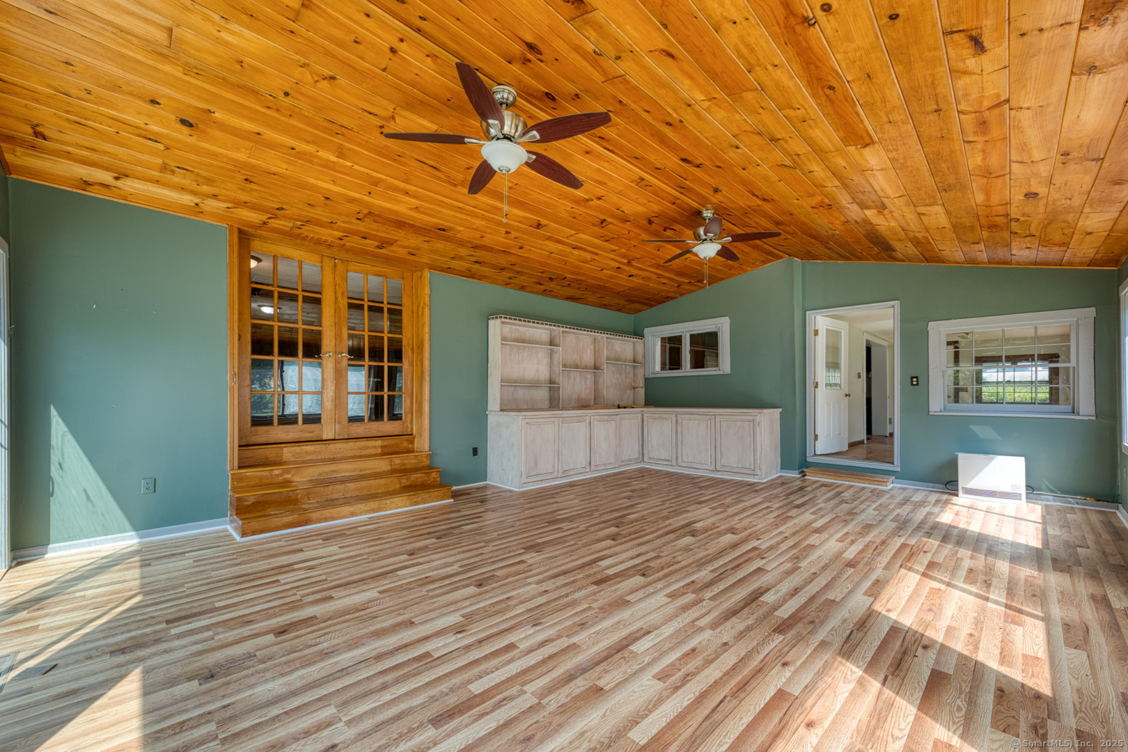 134 East Street Litchfield, CT 06759 - Photo 24 of 38 a view of empty room with wooden floor and fan