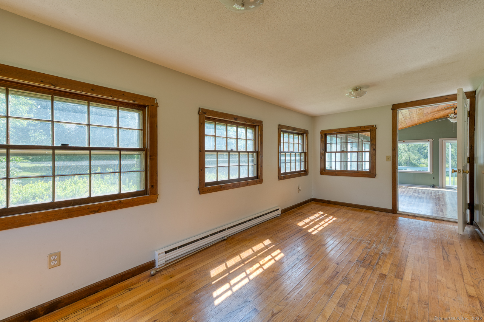 134 East Street Litchfield, CT 06759 - Photo 27 of 38 a view of an empty room with wooden floor and a window