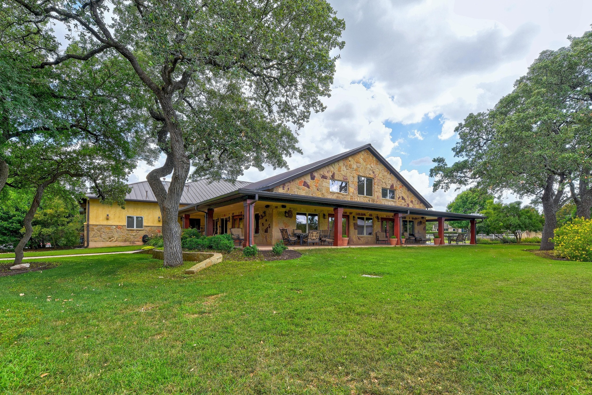 815 River Walk Trail Georgetown, TX 78633 - Photo 35 of 36 a view of a house next to a big yard and large trees