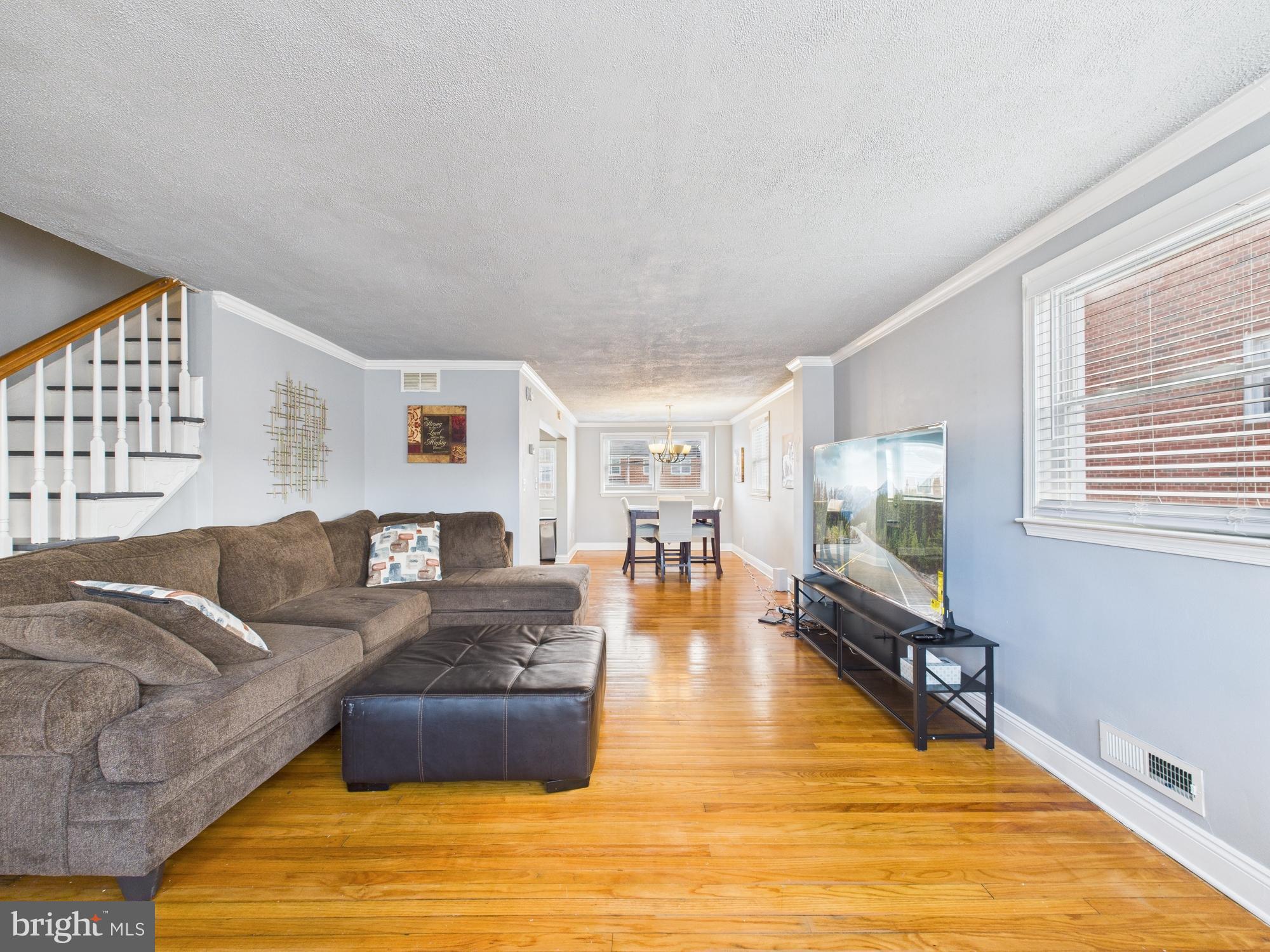 1551 Langford Road Baltimore, MD 21207 - Photo 2 of 52 a living room with furniture and a flat screen tv