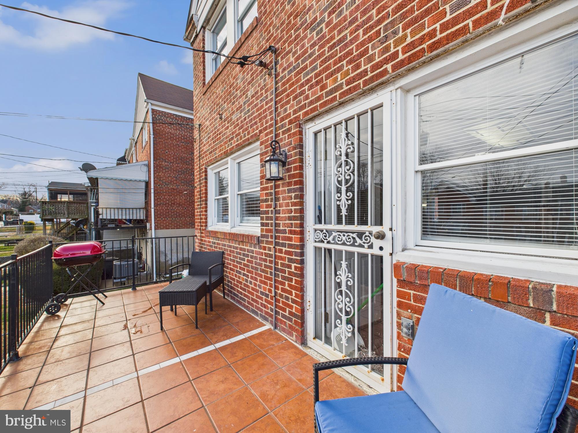 1551 Langford Road Baltimore, MD 21207 - Photo 23 of 52 a view of a patio with a table and chairs and wooden floor