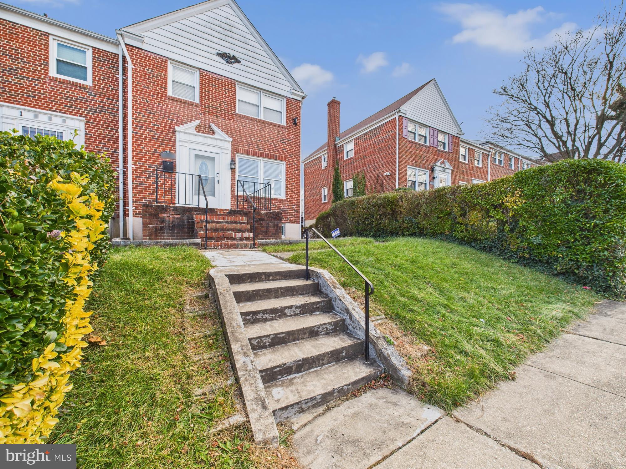 1551 Langford Road Baltimore, MD 21207 - Photo 24 of 52 a front view of a house with a yard table and chairs