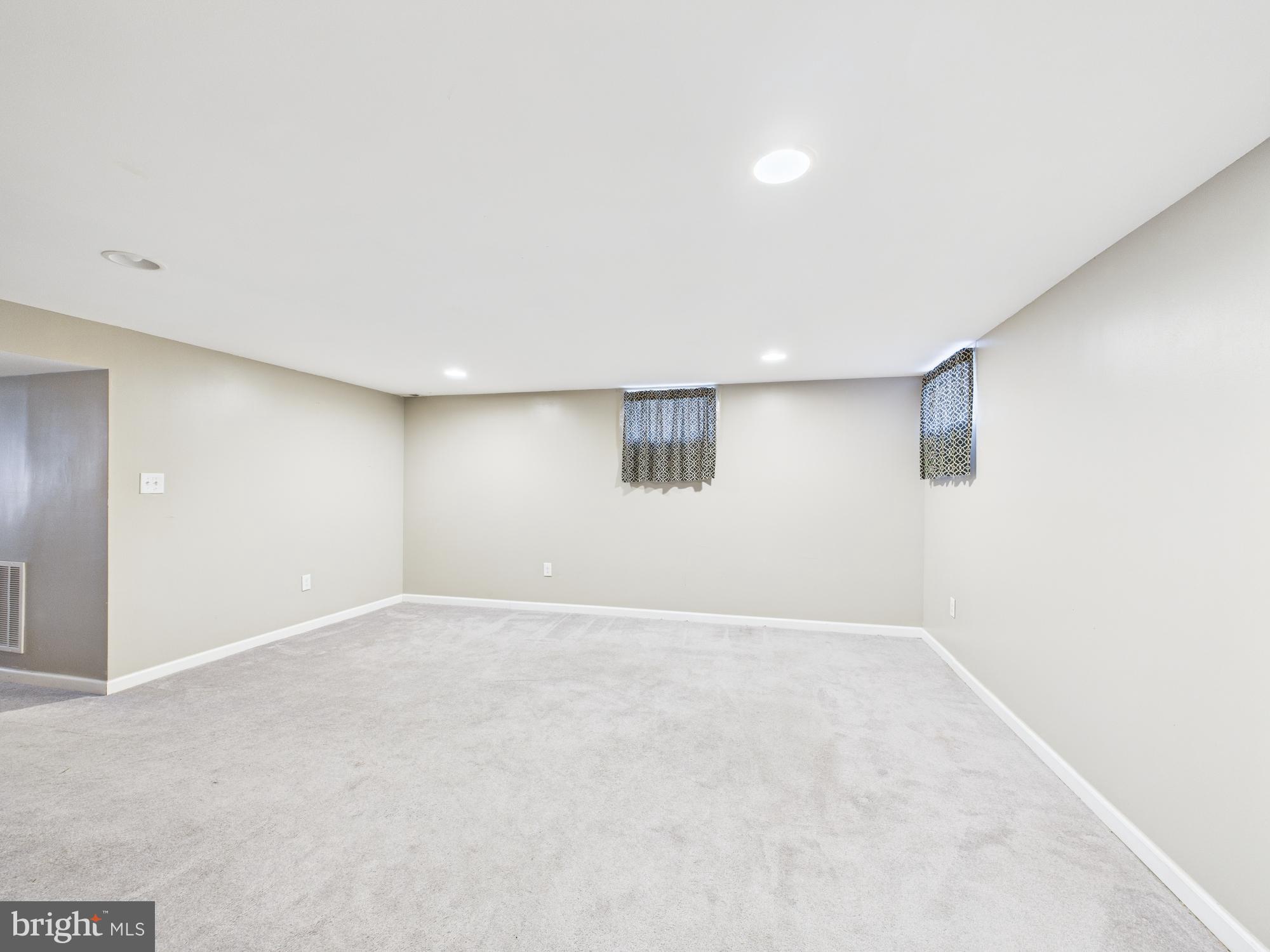 1551 Langford Road Baltimore, MD 21207 - Photo 25 of 52 en empty room with windows