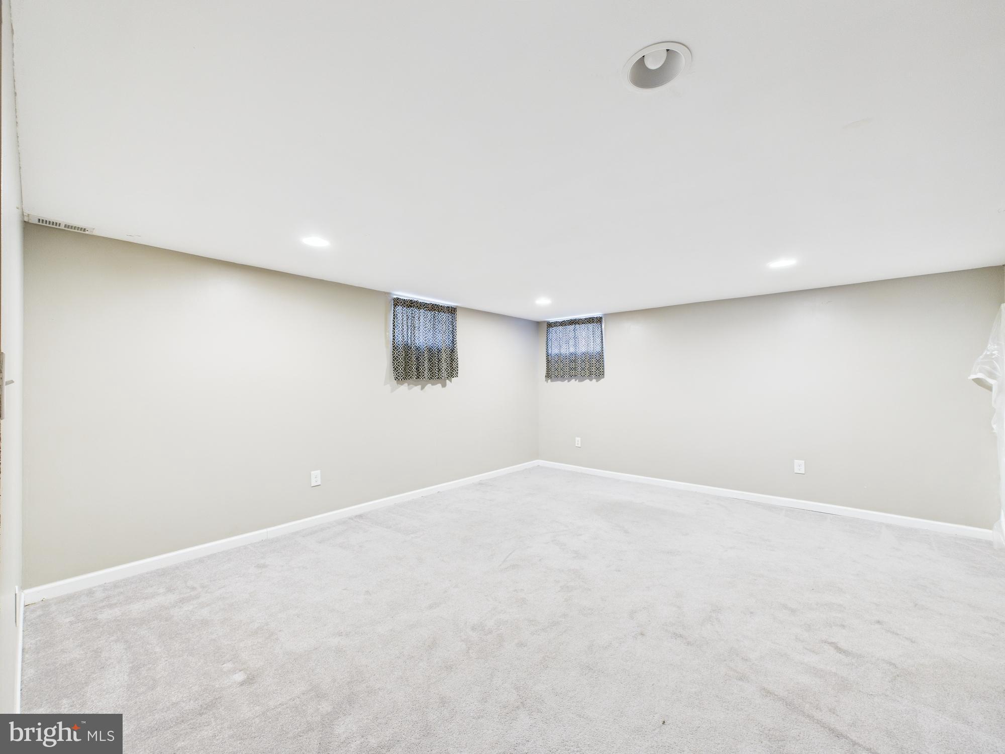 1551 Langford Road Baltimore, MD 21207 - Photo 26 of 52 an empty room with windows