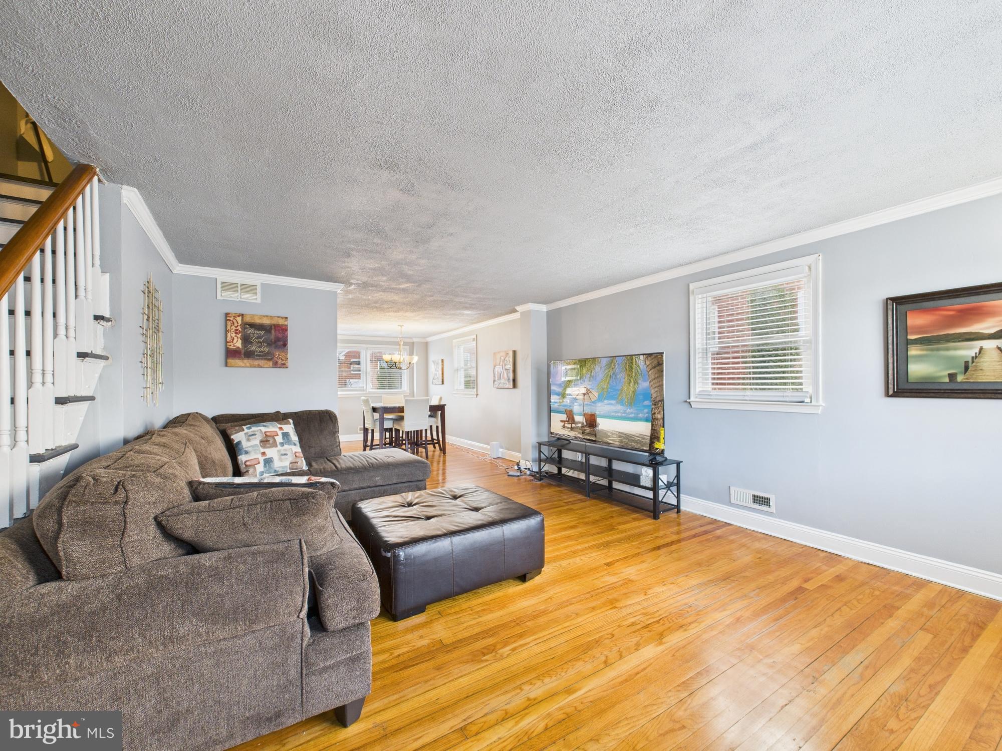 1551 Langford Road Baltimore, MD 21207 - Photo 3 of 52 a living room with furniture and a flat screen tv