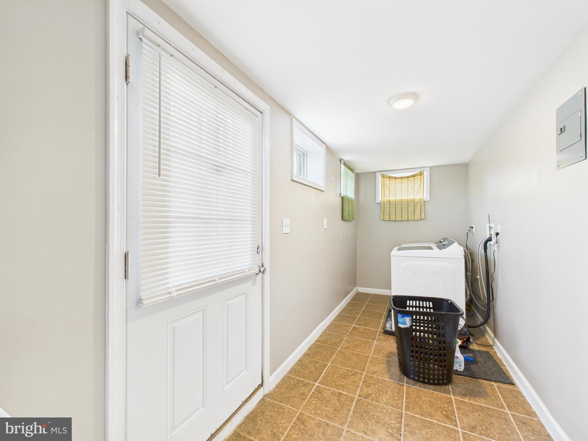 1551 Langford Road Baltimore, MD 21207 - Photo 34 of 52 a living room with furniture and a window