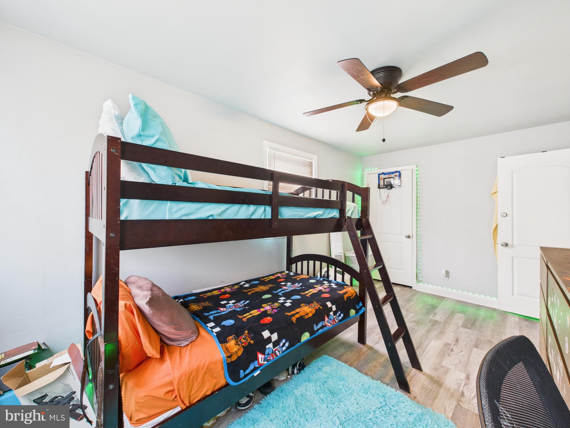 1551 Langford Road Baltimore, MD 21207 - Photo 36 of 52 a bedroom with a bunk bed and a dresser in it