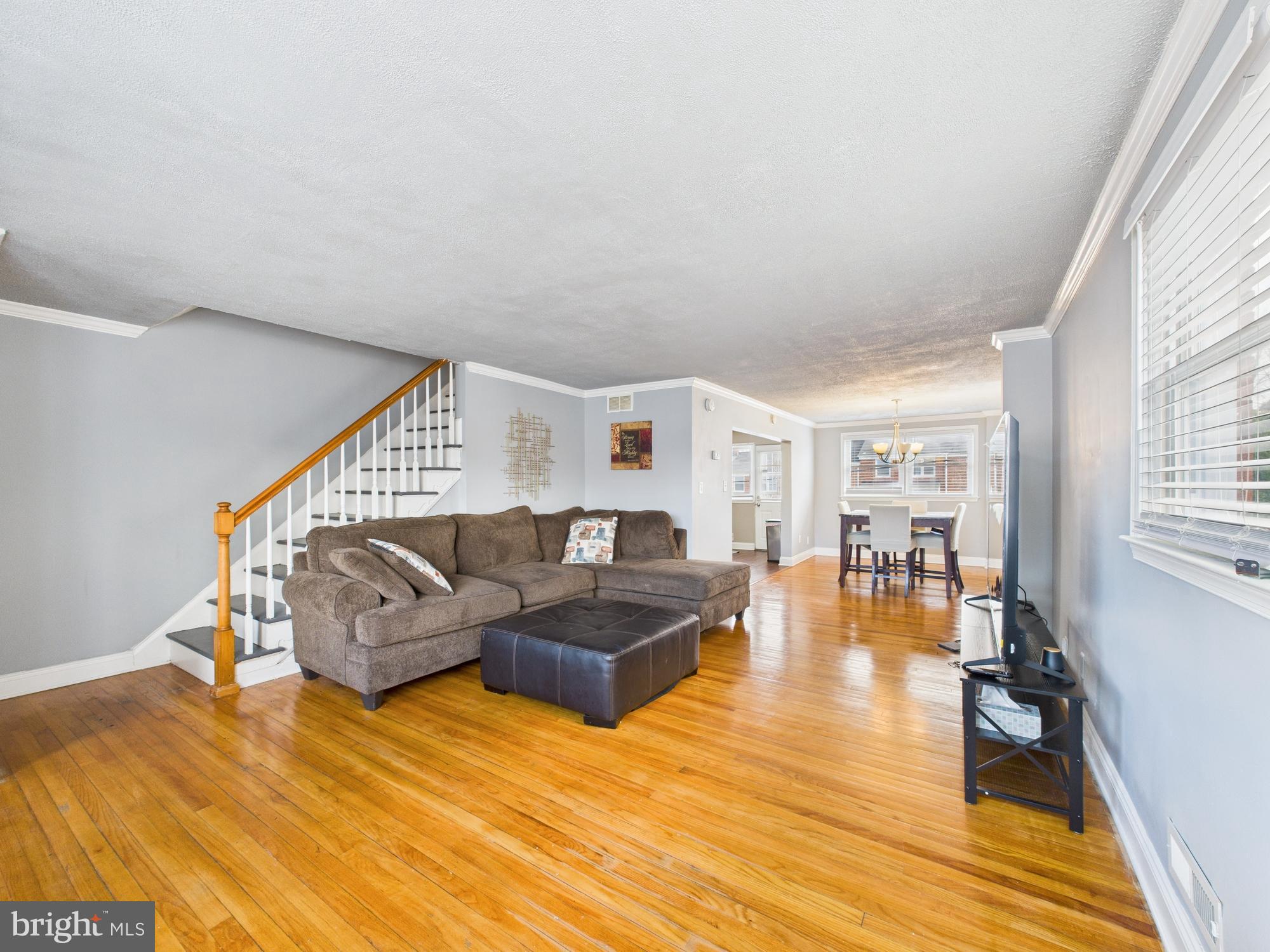 1551 Langford Road Baltimore, MD 21207 - Photo 4 of 52 a living room with furniture and a wooden floor