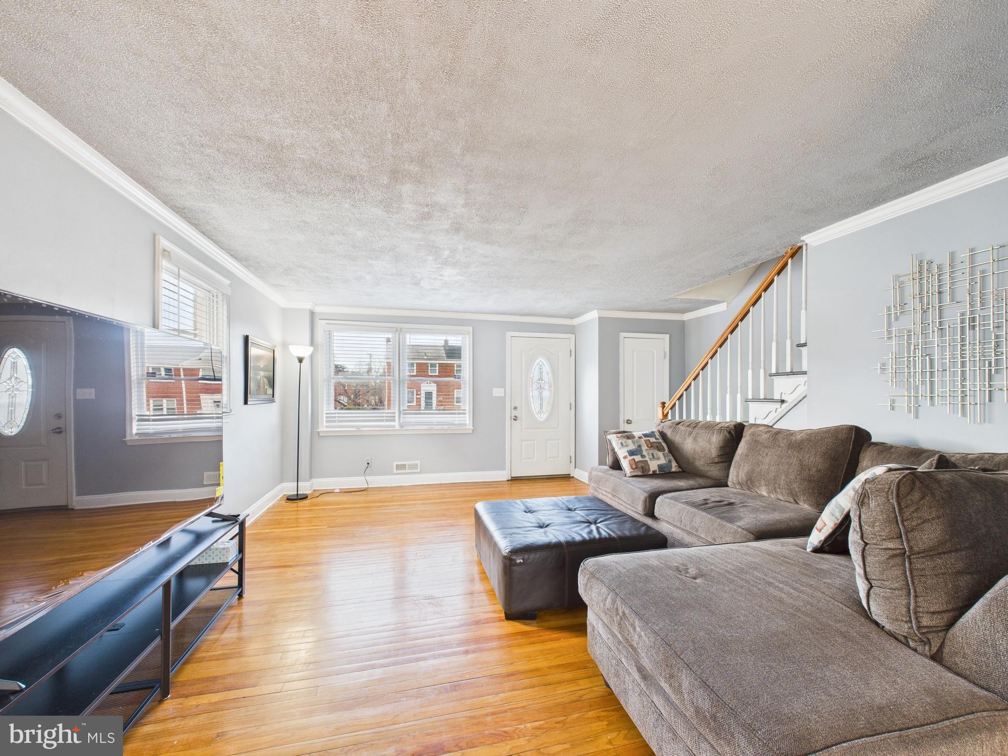 1551 Langford Road Baltimore, MD 21207 - Photo 5 of 52 a living room with furniture and wooden floor