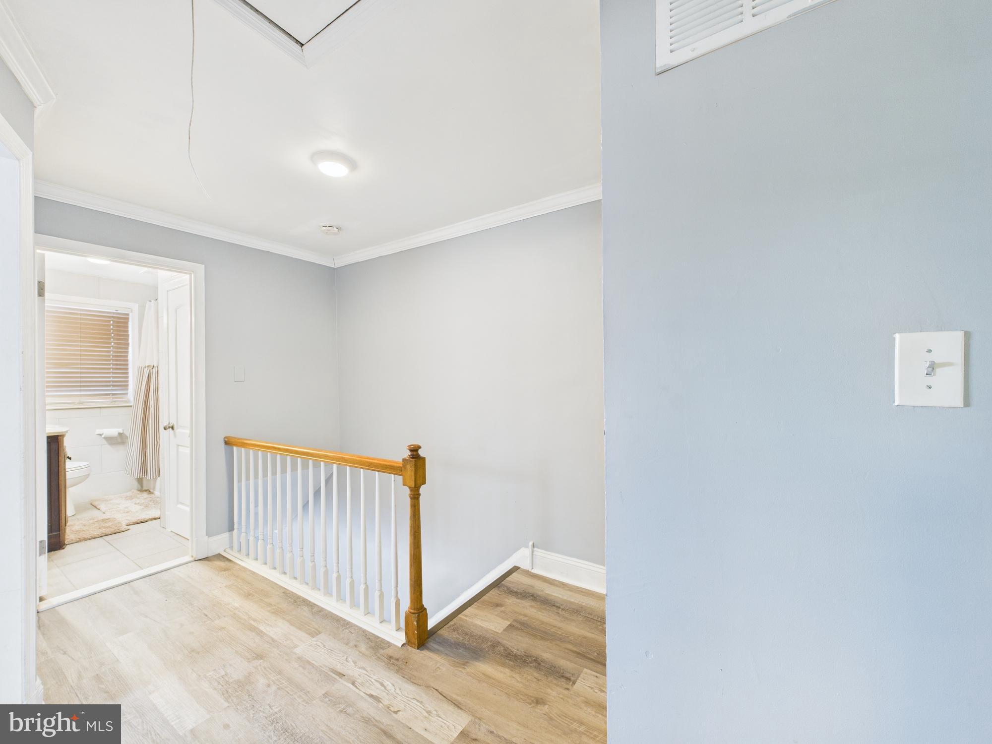 1551 Langford Road Baltimore, MD 21207 - Photo 52 of 52 Bright and airy hallway with modern charm.