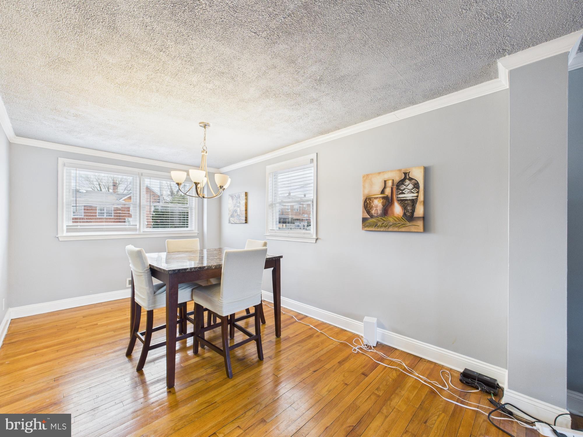 1551 Langford Road Baltimore, MD 21207 - Photo 7 of 52 a view of a dining room with furniture window and wooden floor