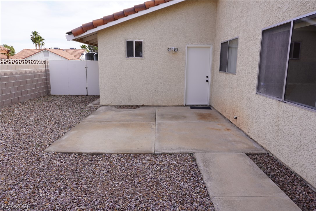 8328 Del Rey Avenue Las Vegas, NV 89117 - Photo 33 of 38 A well-maintained concrete patio provides a functional outdoor space for relaxation.
