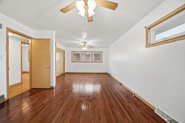 a view of a livingroom with wooden floor