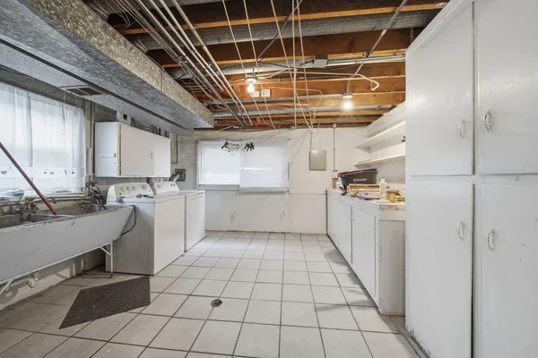a kitchen with a sink and cabinets