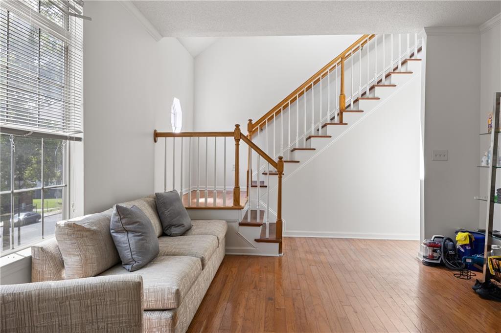 581 Cooper Street Southwest Atlanta, GA 30312 - Photo 7 of 26 a living room with furniture and wooden floor