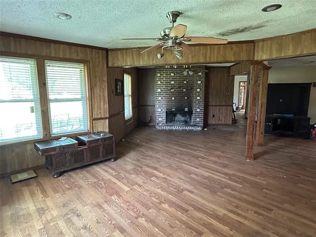 a living room with furniture window and wooden floor