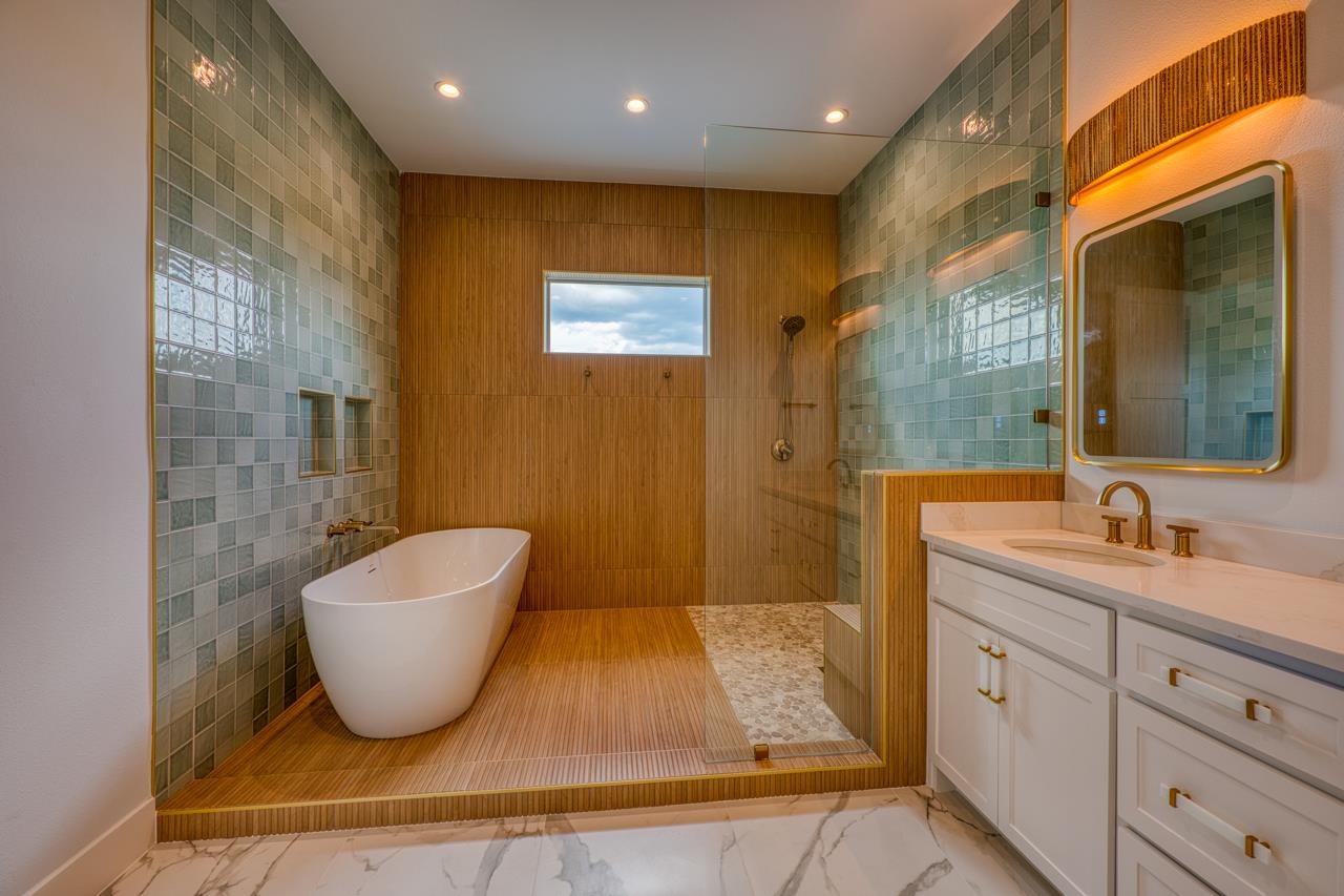 320 Lake Street Kingsland, TX 78639 - Photo 15 of 30 a spacious bathroom with a double vanity sink a mirror and a bathtub