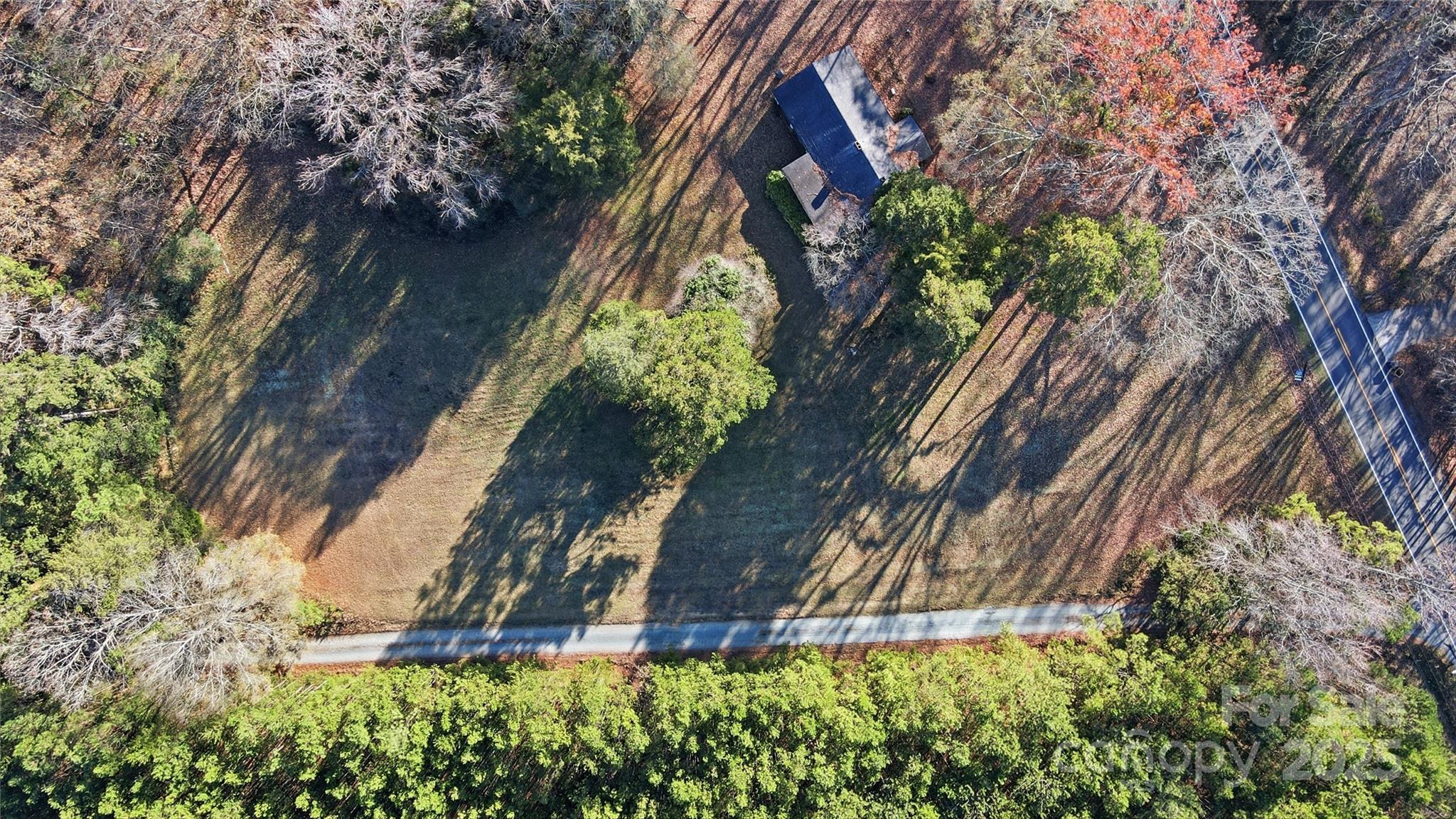 0 Fincher Road Matthews, NC 28104 - Photo 11 of 18 a backyard of a building with large trees